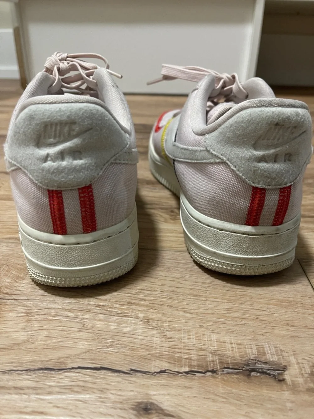Nike Women's Pale Pink Low-Top Sneakers with Red and Yellow Accents - Picture 3 of 3